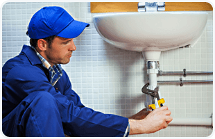 Plumber repairing pipes