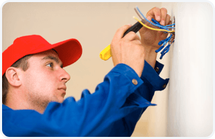 Electrician fixing the switch